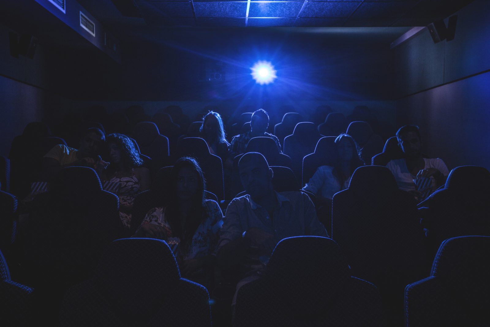 people in a dark movie theatre