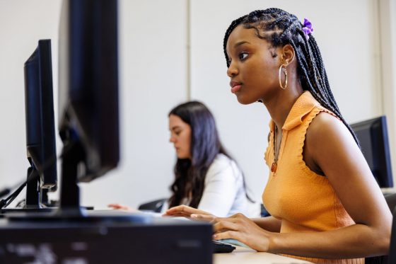 Two students working at computers
