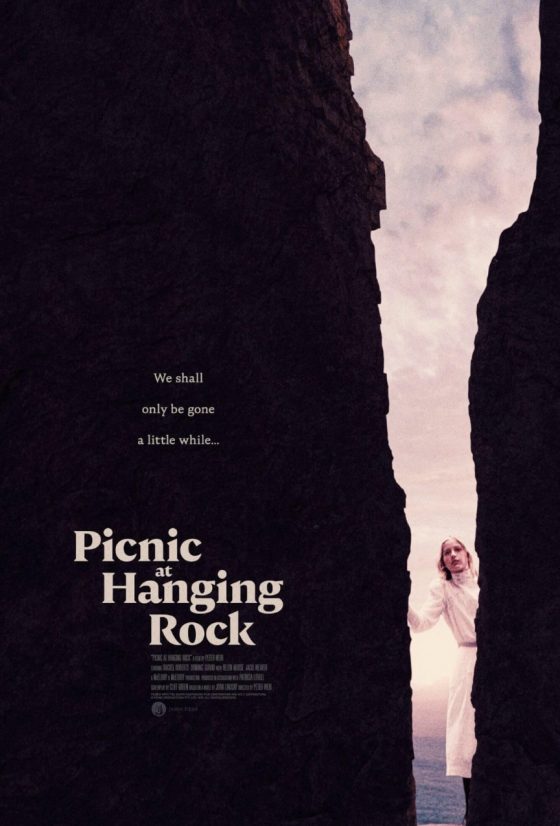 poster for the Film Picnic at Hanging Rock. A young girl loks through a crack in the cliff wall.