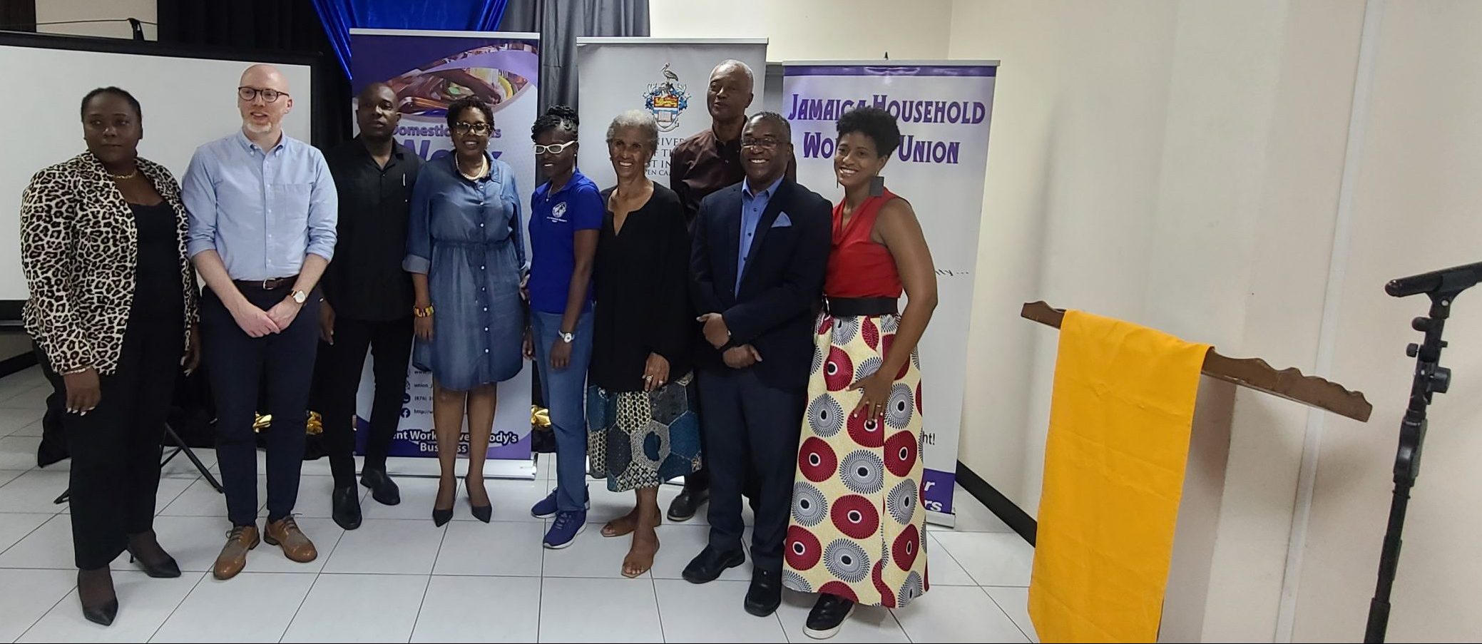 group of researchers and policy makers poses at report launch event in Kington, Jamaica 
