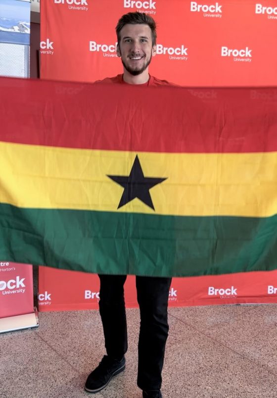 Mark Chrabalowski holds Ghana flag