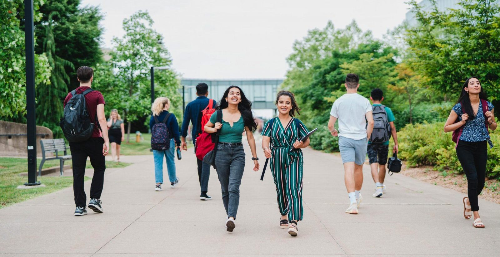 Students walking down a pathway on Brock University's main campus.