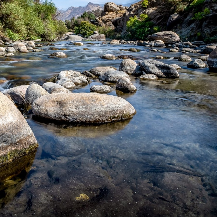 Stream-of-water-3.0-1600x900 A creek full of water and rocks.