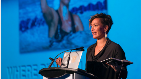 woman standing at a podium