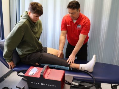 Varsity athlete receiving treatment with game ready equipment
