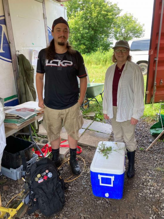 Alex Popescu and I at La Baigneuse July 2024 Liette Vasseur and Alex Popescu stand side-by-side doing field research
