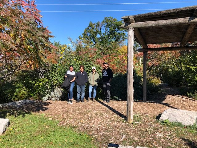 environmental students standing in the healing garden at the Niagara-on-the-Lake campus of Niagara College, at the foot of the Niagara Escarpment Biosphere