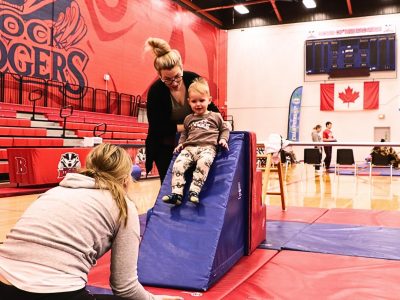 Child sliding down slide in Brock's Children's Movement Program