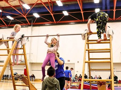 Child on monkey bars in Brock's Children's Movement Program
