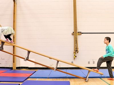 Child climbing incline in Brock's Children's Movement Program
