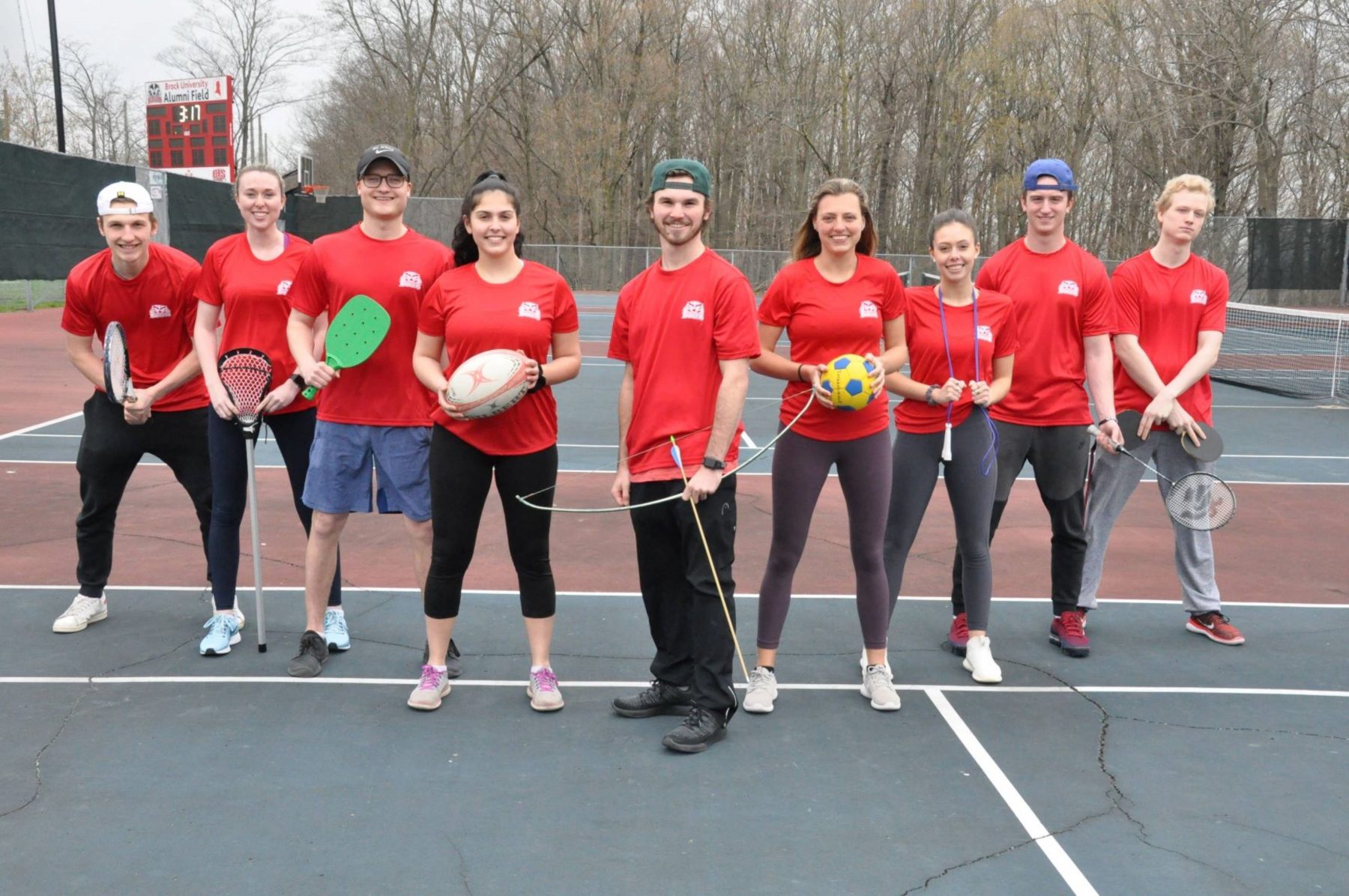 group of Brock recreation students with various sporting equipment