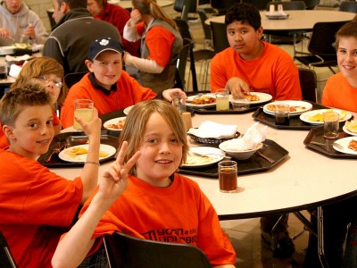Youth students eating lunch at a round table